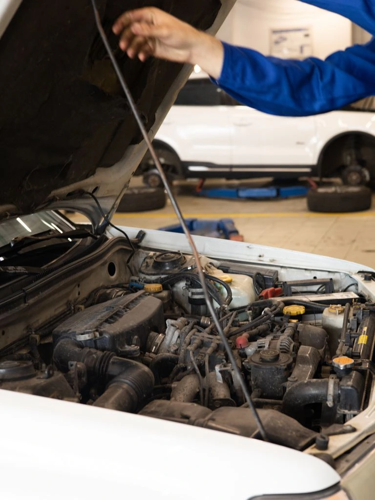 An open service manual resting on a workbench