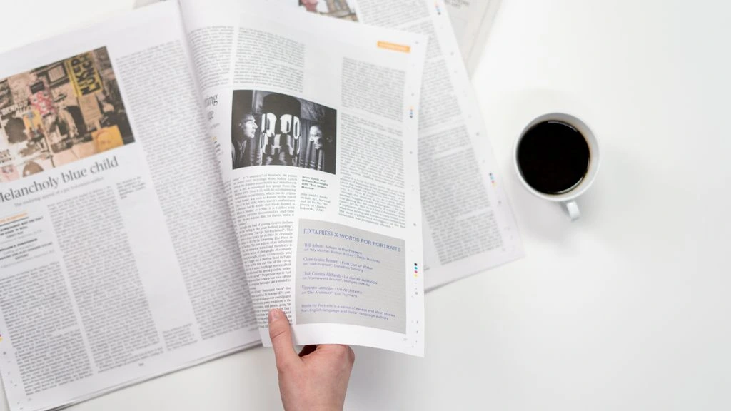 Open printed service manual page with torque-spec table and pencil annotations